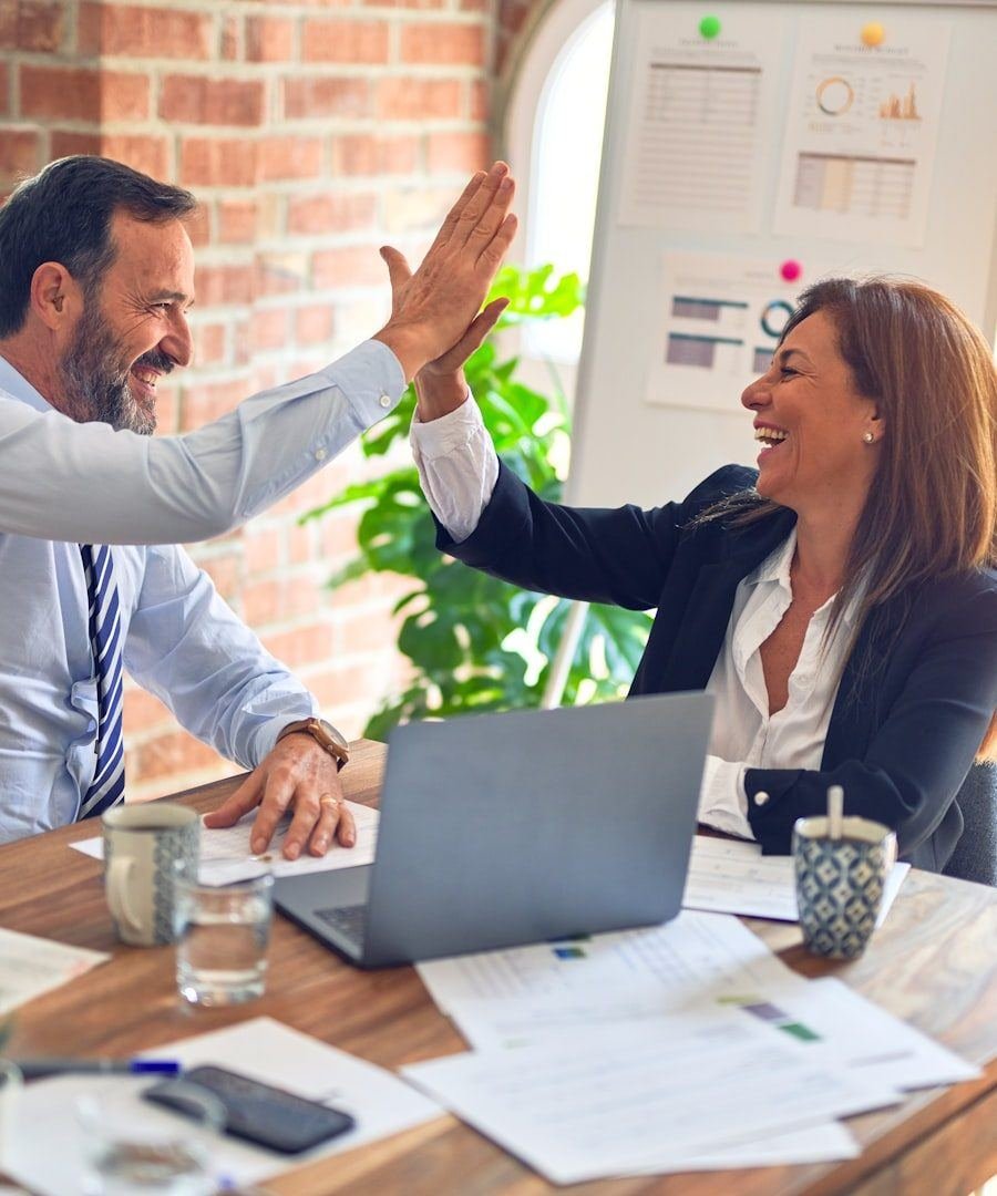 Client and strategist reviewing campaign performance together
