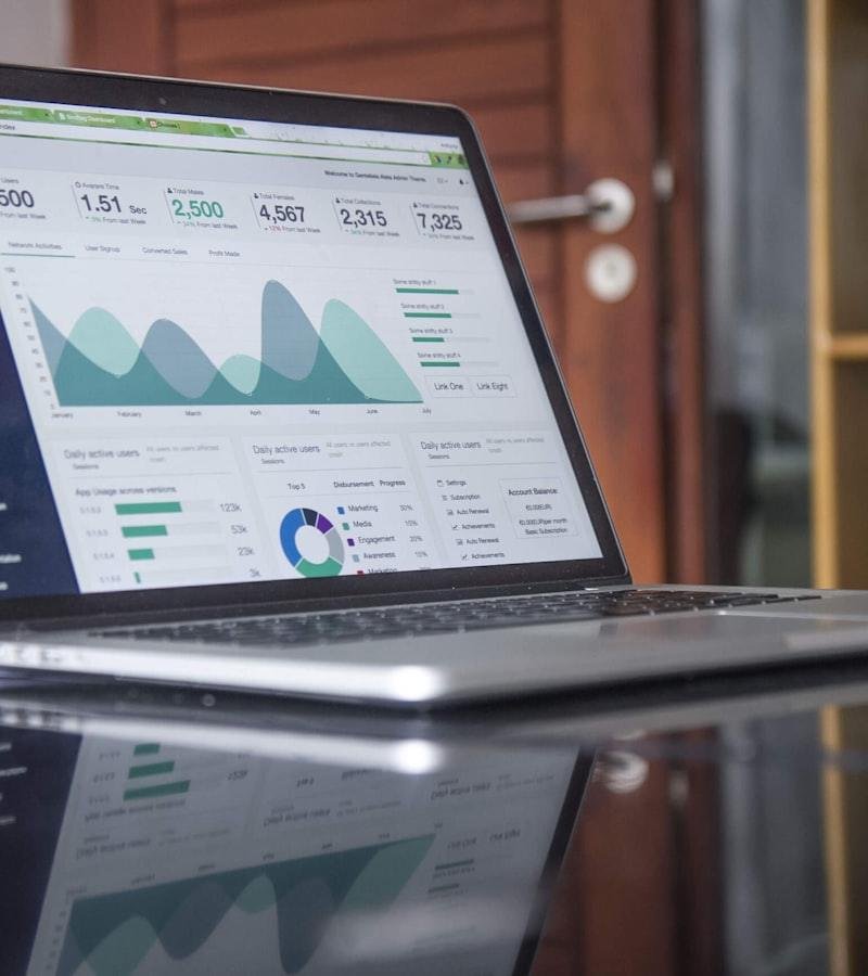 Paid media performance report on a laptop screen