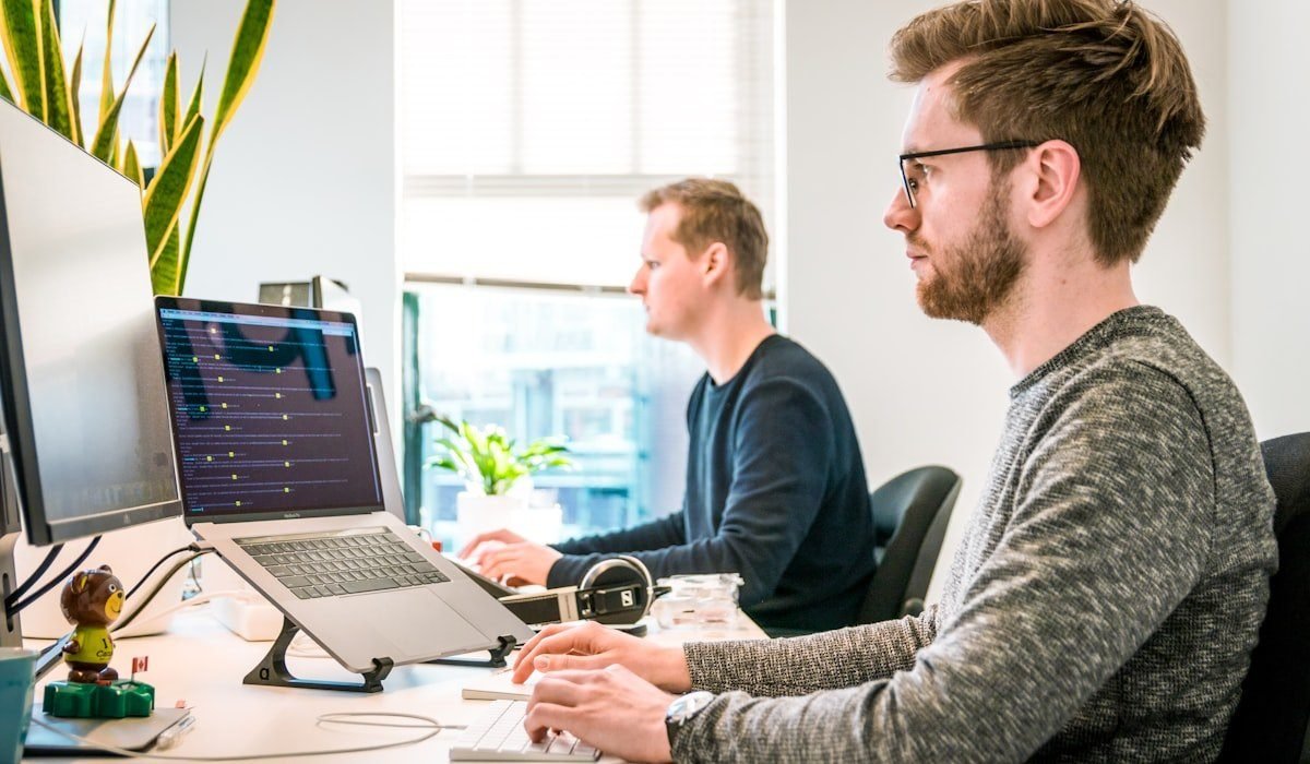 SEO team working on a technical audit in a dark office